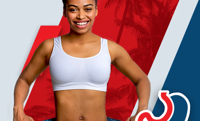 Thin smiling woman in large pants after bariatric surgery